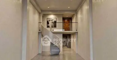 Stunning modern interior with elegant spiral staircase and high ceilings, perfect for luxury living.