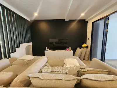 Cozy living room with modern decor and plush seating, perfect for relaxation and entertainment.