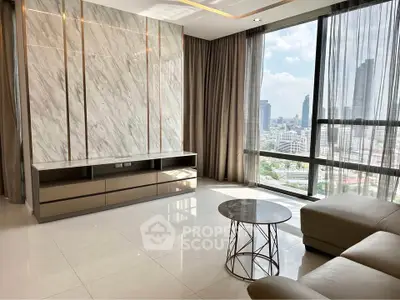 Luxurious living room with stunning city view and modern furnishings.