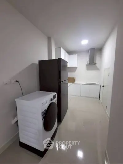 Modern kitchen with sleek appliances and spacious layout