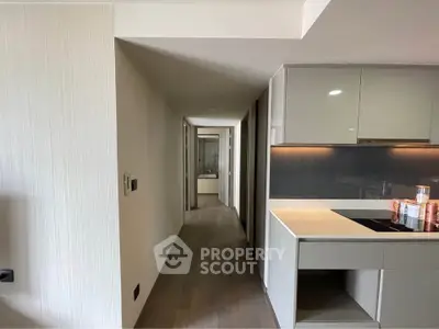 Modern kitchen with sleek cabinetry and open layout in contemporary apartment
