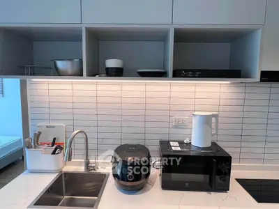 Modern kitchen with sleek appliances and stylish cabinetry