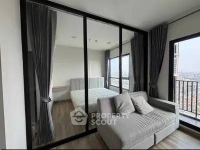 Modern bedroom with glass partition and city view balcony in high-rise apartment