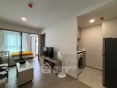 Modern apartment interior with open living room and kitchen, featuring a cozy bedroom and stylish decor.