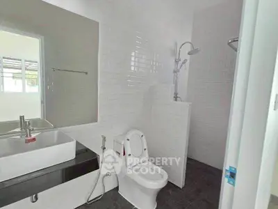 Modern bathroom with sleek fixtures and white subway tiles