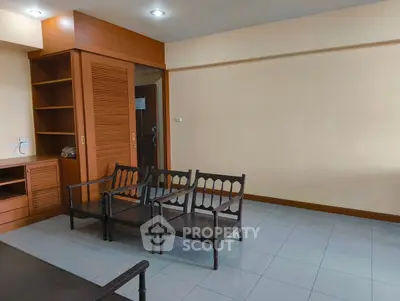 Spacious living room with wooden furniture and built-in storage