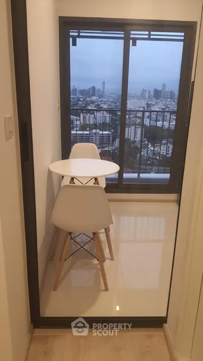 Chic balcony with city view, perfect for morning coffee or evening relaxation.