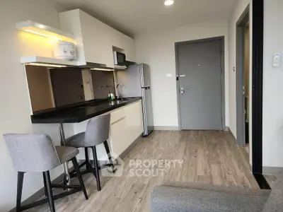 Modern kitchen with sleek design and breakfast bar in stylish apartment