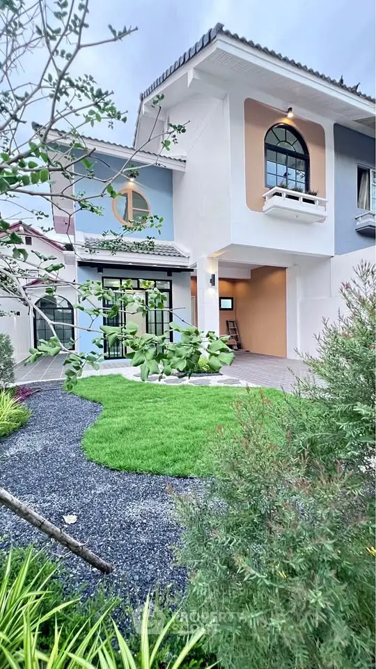 Charming modern house with lush garden and unique architectural design.