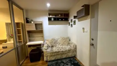 Cozy living room with modern decor and comfortable seating in a stylish apartment.