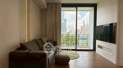 Modern living room with large window and city view, featuring a cozy sofa and wall-mounted TV.