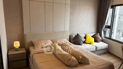 Modern bedroom with cozy bed and stylish decor in a high-rise apartment.