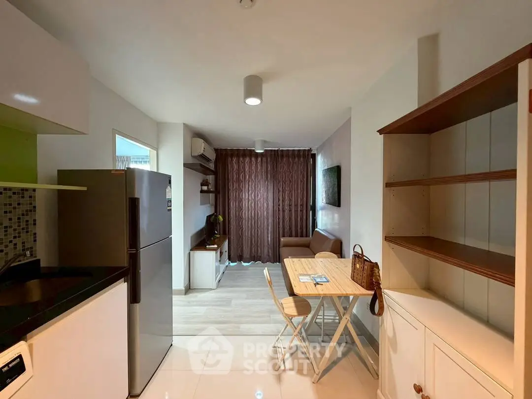 Modern open-layout kitchen and living area with stylish decor and natural light