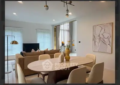 Modern living room with elegant dining area and stylish decor