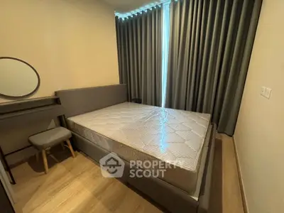Cozy bedroom with modern furniture and elegant curtains