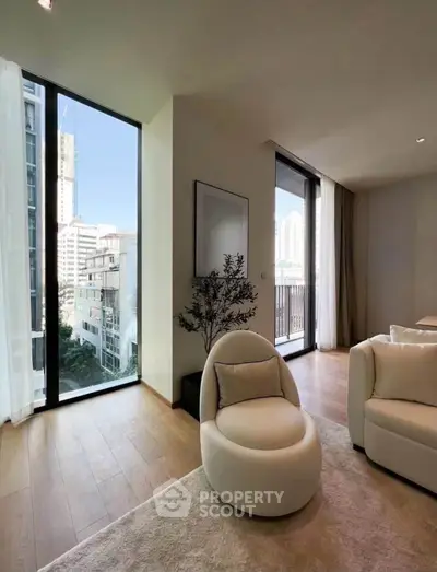 Modern living room with floor-to-ceiling windows and city view