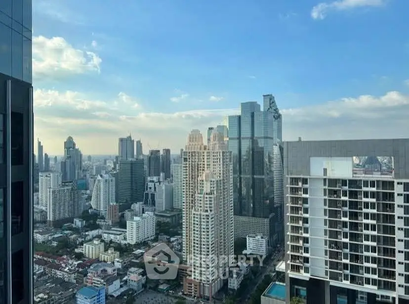 Stunning cityscape view from a high-rise building showcasing modern architecture and urban skyline.