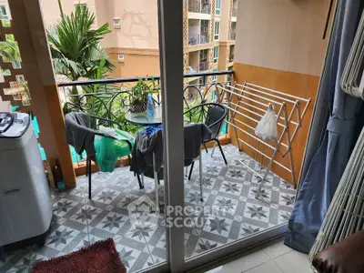 Charming balcony with pool view, perfect for relaxation and outdoor dining in a modern apartment.