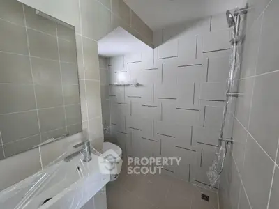 Modern bathroom with sleek tiles and contemporary fixtures