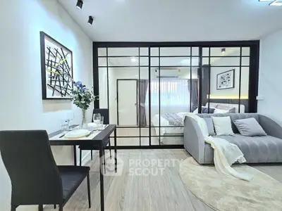 Modern open-plan living room with stylish decor and cozy seating area