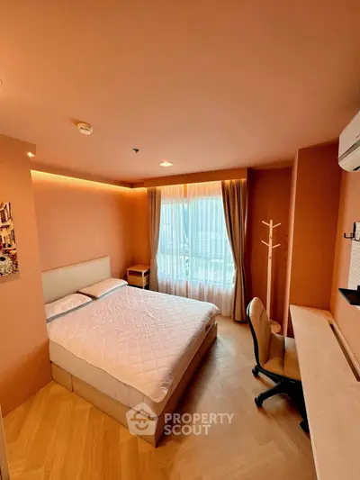 Cozy bedroom with modern furnishings and natural light