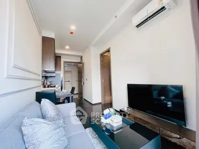 Modern living room with sleek furniture and open kitchen layout