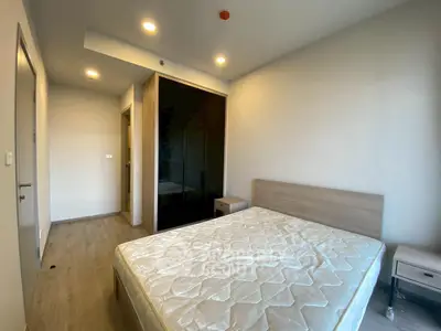 Modern bedroom with minimalist design and ample natural light