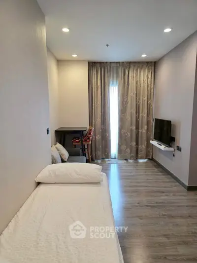 Cozy bedroom with modern decor and natural light