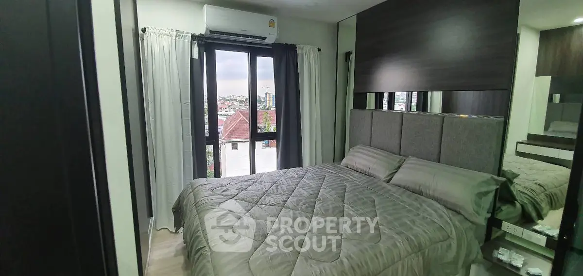 Cozy bedroom with city view and modern decor