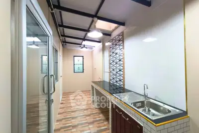 Modern kitchen with sleek design and ample natural light