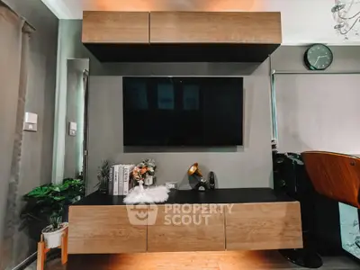 Modern living room with sleek wooden TV unit and stylish decor