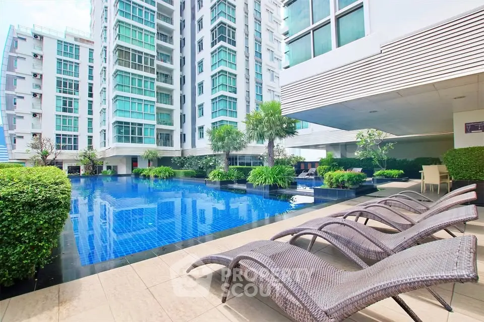 Luxurious apartment complex with stunning pool and modern architecture