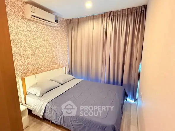 Cozy bedroom with air conditioning and elegant curtains in modern apartment.