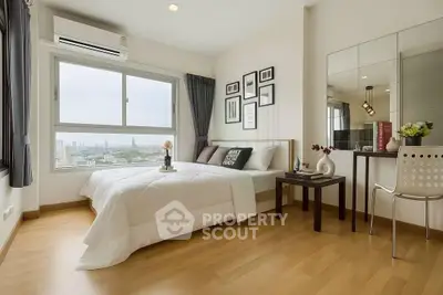 Modern bedroom with city view, wooden flooring, and stylish decor in a high-rise apartment.