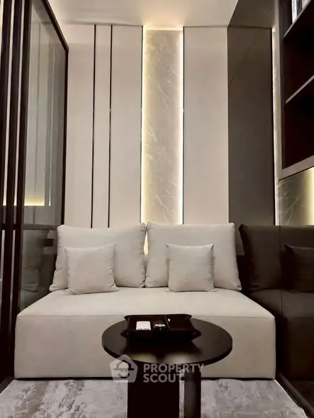 Modern living room with sleek design and cozy seating area.