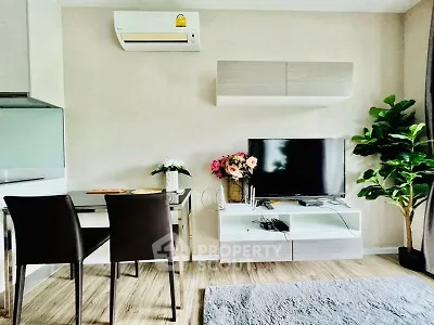 Modern living room with sleek furniture and air conditioning, perfect for comfortable living.