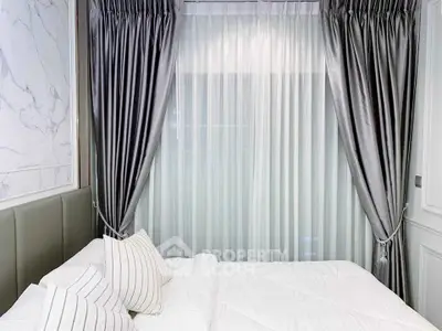 Luxurious bedroom with elegant curtains and plush bedding