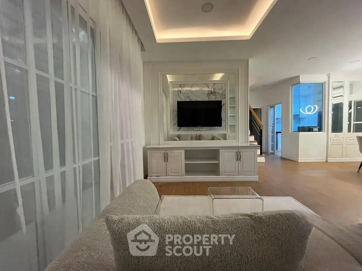 Luxurious living room with modern decor and built-in TV unit