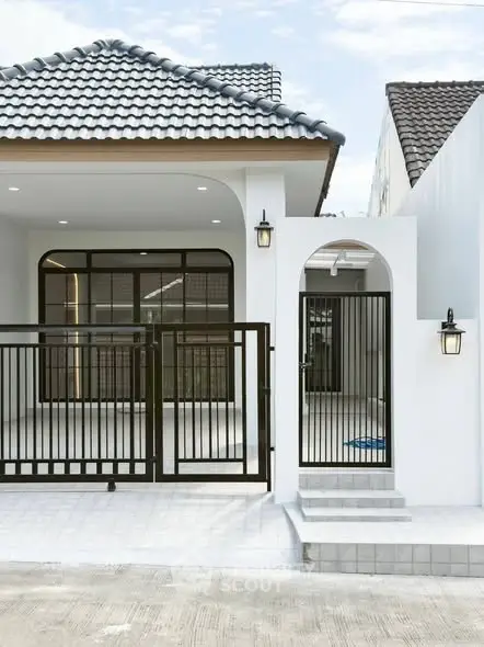 Modern house exterior with stylish gate and tiled roof