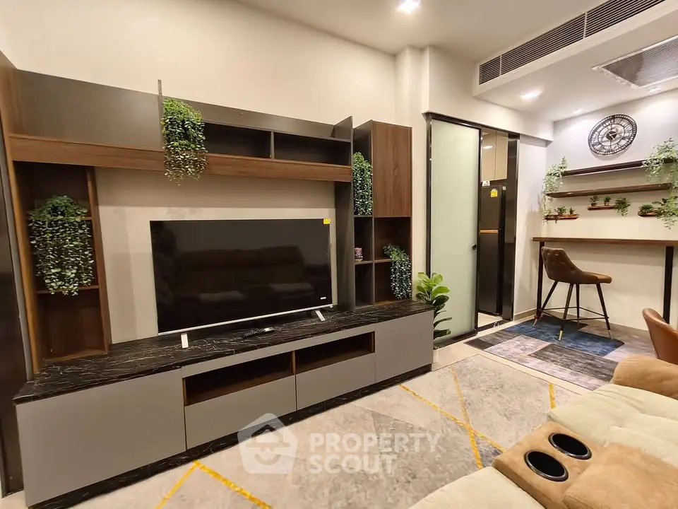 Modern living room with stylish TV unit and cozy seating area