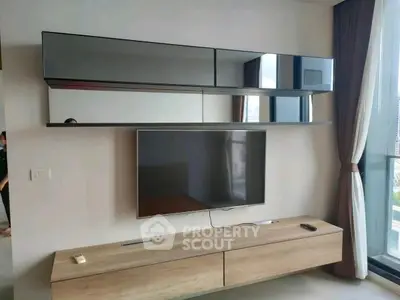 Modern living room with sleek TV setup and stylish storage units