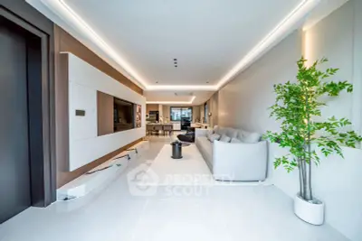 Luxurious modern living room with sleek design and spacious layout, featuring elegant furniture and ambient lighting.