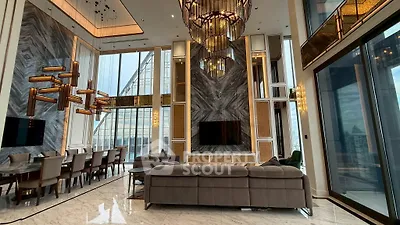 Luxurious high-rise living room with stunning city views and elegant modern decor.