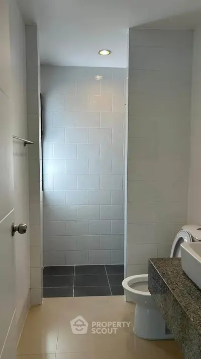 Modern bathroom with sleek design and tiled shower area