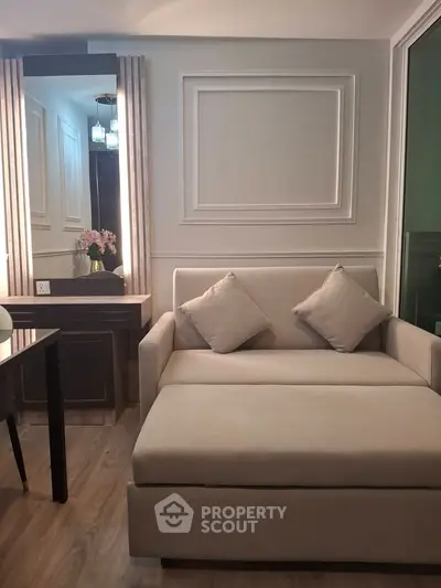 Elegant living room with stylish sofa and chic decor, perfect for modern urban living.
