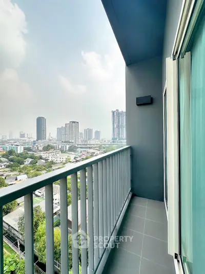 Modern high-rise balcony with stunning cityscape view, perfect for urban living enthusiasts.