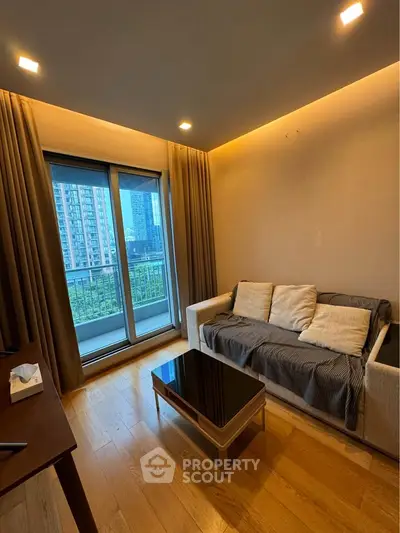 Modern living room with cozy sofa and city view balcony in urban apartment.