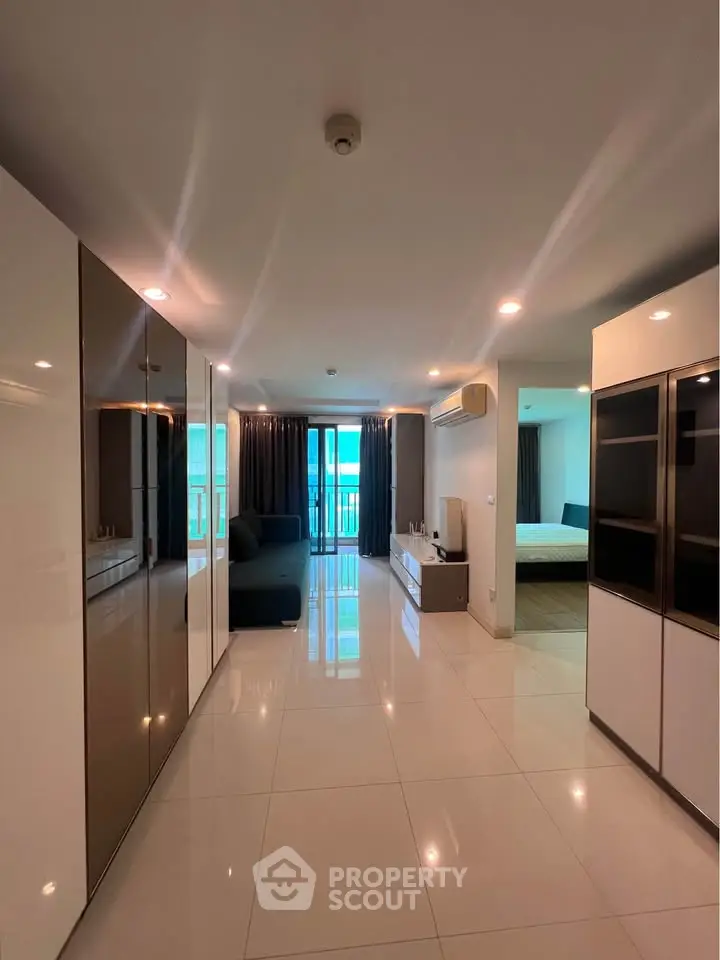 Spacious modern living room with sleek design and large windows for natural light.