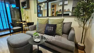 Modern living room with stylish decor and cozy seating area.