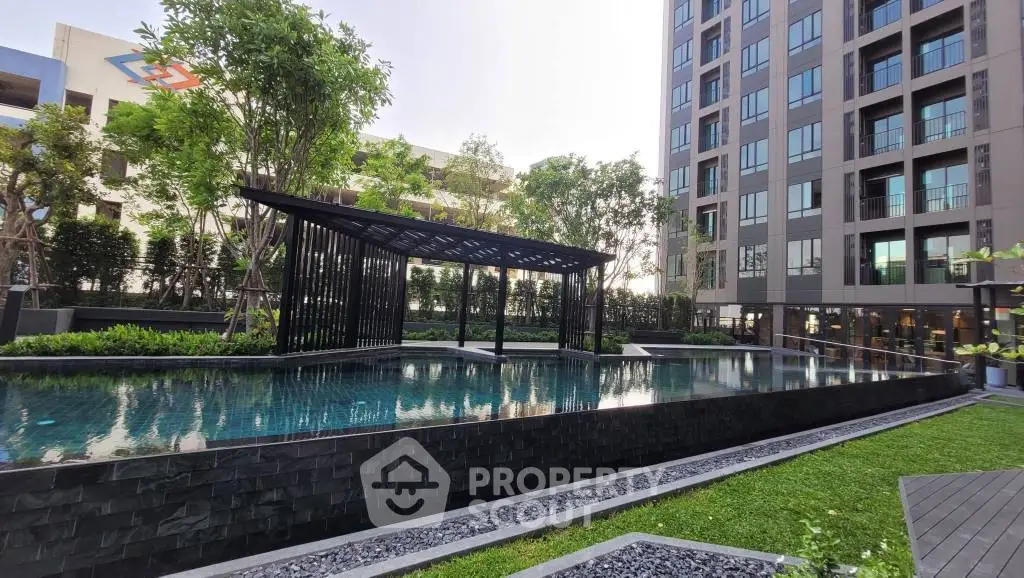 Modern apartment building with luxurious pool and landscaped garden